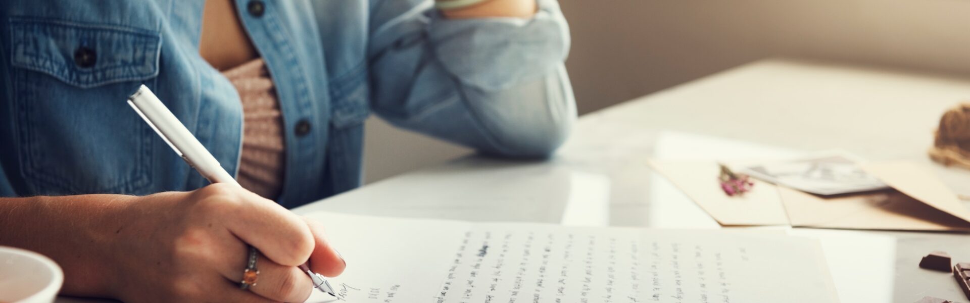 Caucasian woman writing a letter